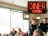 The entire diner cleared out, and everyone actively avoided the heavily tattooed, feared biker sitting alone in the corner. But the tense silence shattered when a little girl in a wheelchair rolled right up to his table and softly asked, ‘Can I sit here?