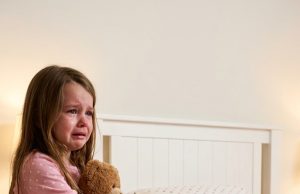 As a 911 dispatcher, I’ve heard it all, but my blood ran cold when a 5-year-old girl called whispering, ‘Someone is hiding under my bed.’ We rushed units to the scene, but what we actually uncovered beneath the mattress made my heart completely stop.